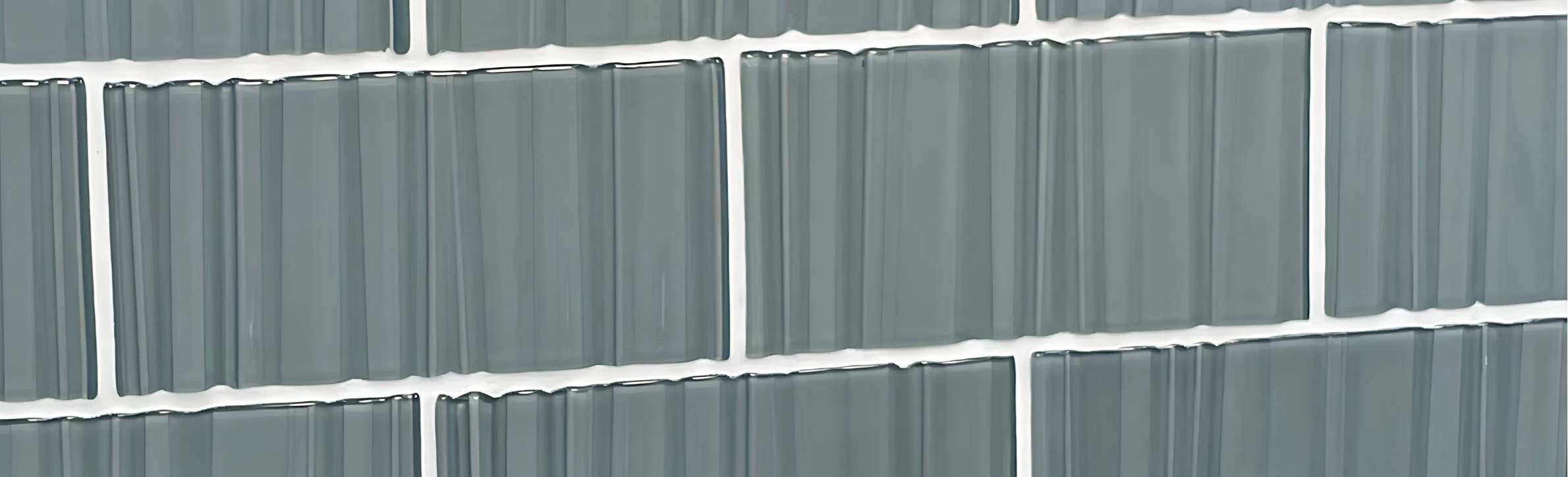 Pattern of gray rectangular tiles with white grout lines