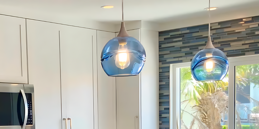 Blue and White kitchen remodel blog banner featuring two bicycle glass blue globes