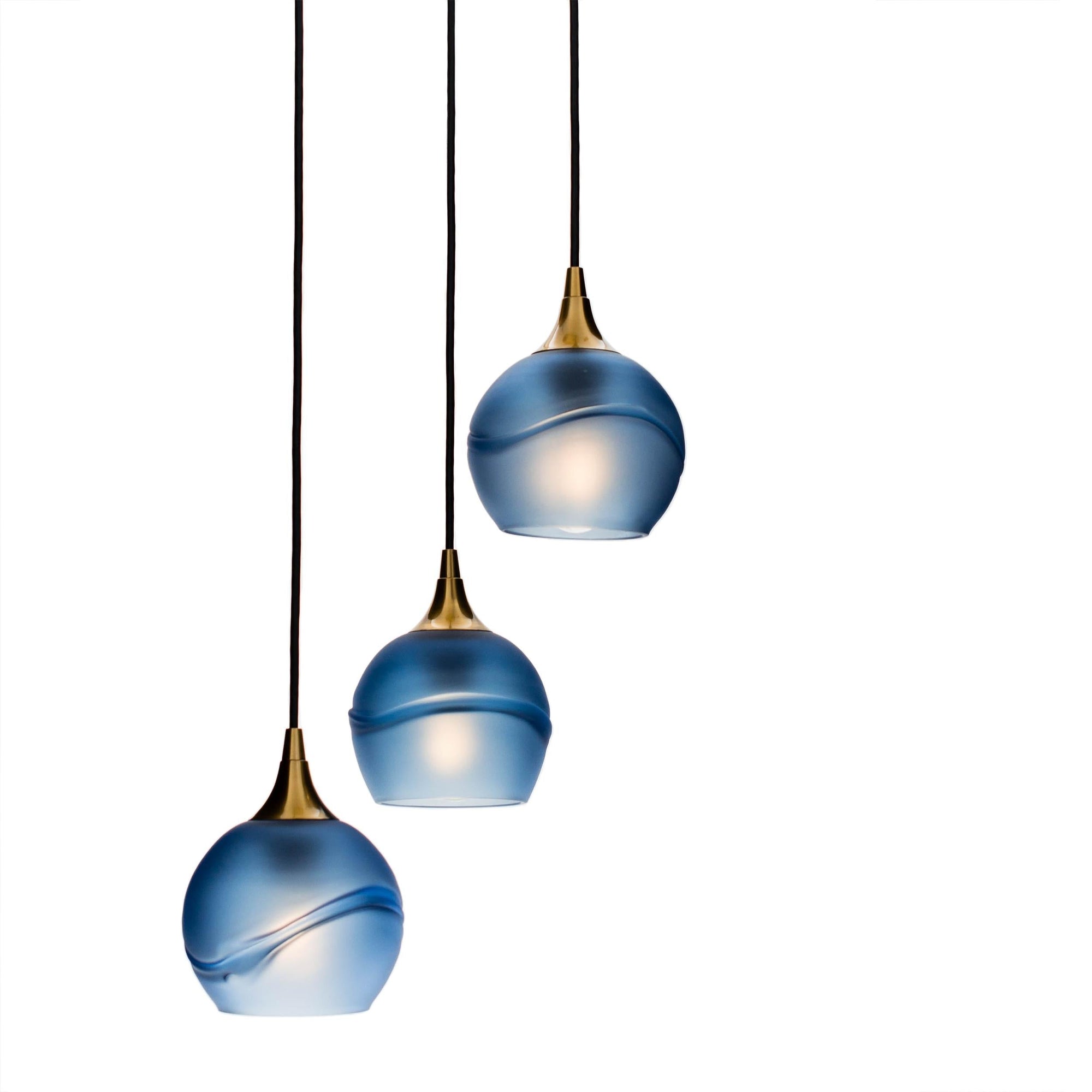 Bicycle Glass Co 763 Glacial: 3 Pendant Cascade Chandelier, Steel Blue Glass, Polished Brass Hardware, Detail Shot, Light Bulbs On