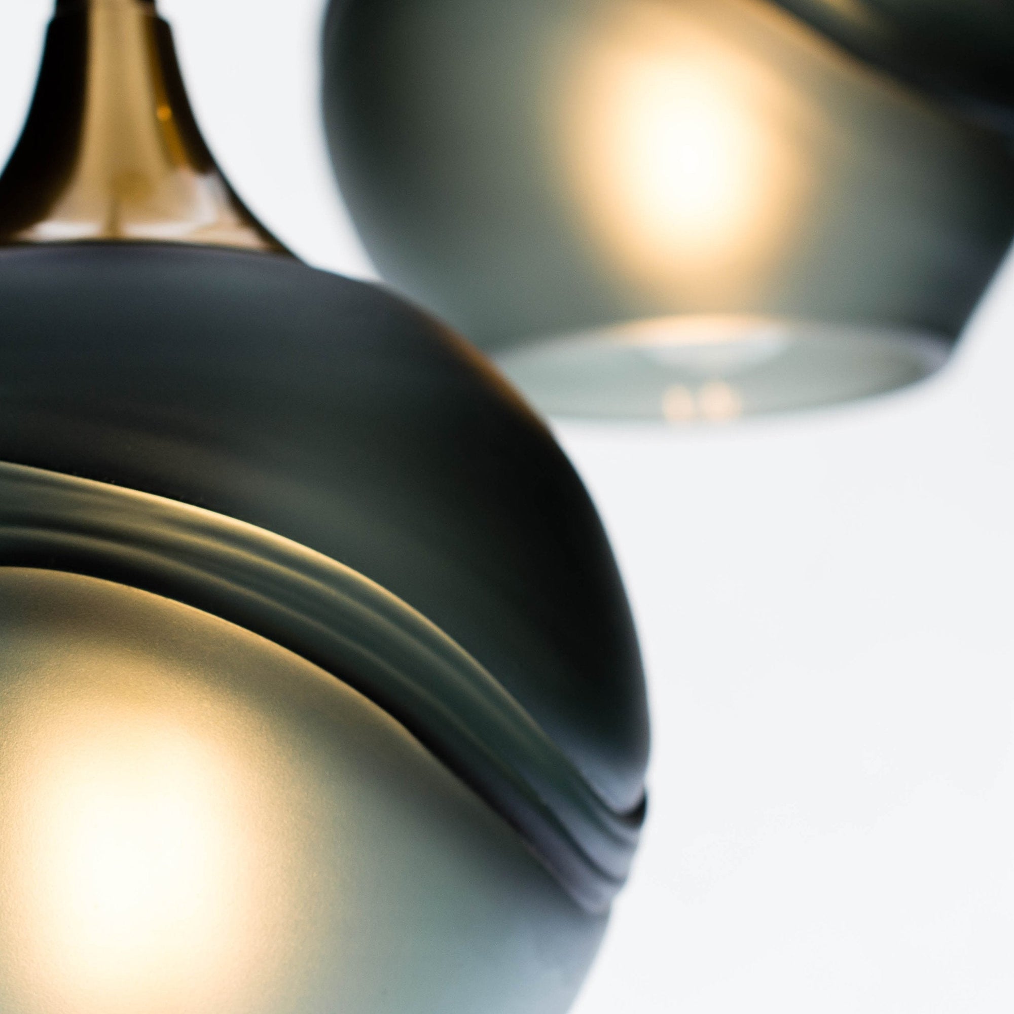 Bicycle Glass Co 763 Glacial: 3 Pendant Cascade Chandelier, Slate Gray Glass, Polished Brass Hardware, Detail Shot, Extreme Close Up, Light Bulbs On